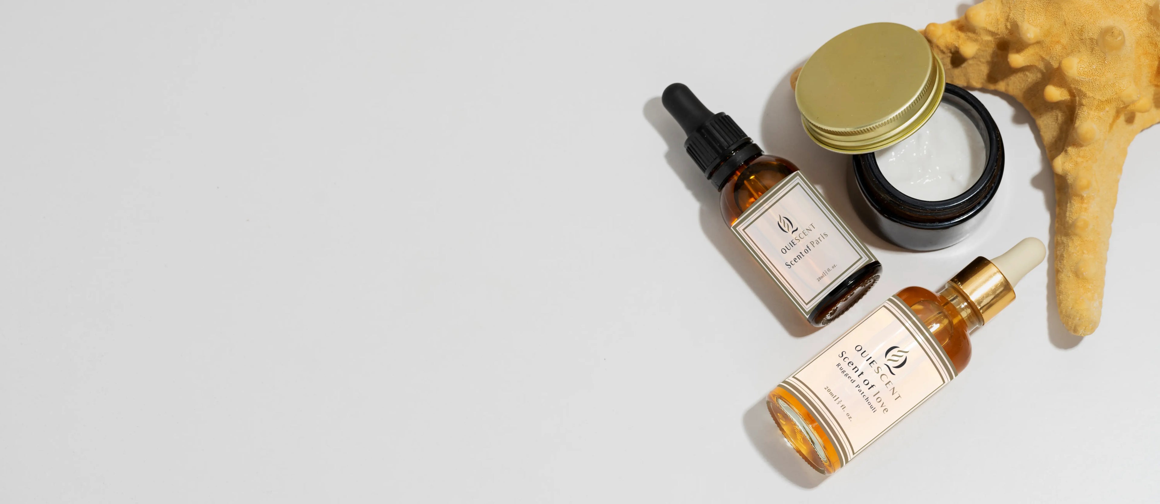 Three skincare products on a light gray background